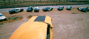 One of the many times the 1973 Ford Mustang confronts a lineup of squad cars in "Gone in 60 Seconds".