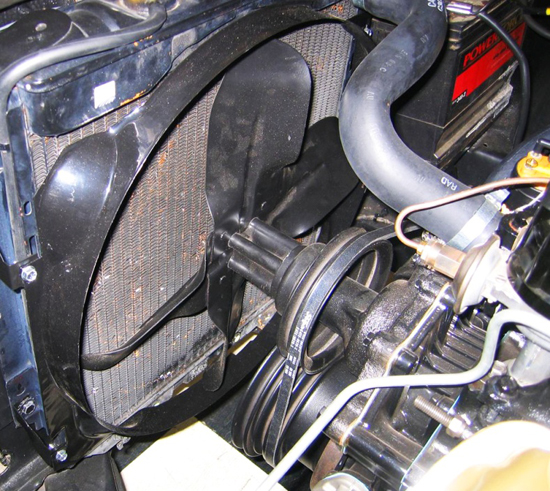 Shown in this picture of a 1966 Ford Mustang engine bay is an actual “fan belt” used to drive a cooling fan. Until recent decades, this was the traditional setup on vehicles with longitudinally-mounted engines.