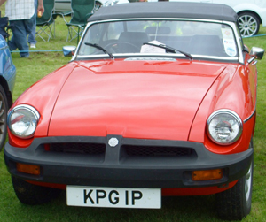 Caption for above photo: When 1974 model year regulations went into effect, some manufacturers such as MG took a different approach – using a rubber coating to add style across all surface areas of larger bumpers. (1974 MGB model shown)