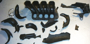 Plastic naturally dries out and becomes brittle with the passage of time. Compounds used in early intake manifolds like this one were often cast too thin, and were subject to cracks and breakage due to inadequate reinforcement around external fittings.
