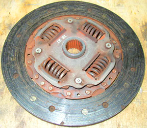 This picture shows an example of a clutch disc that’s worn to the point where hardly any friction material is left on the surface.