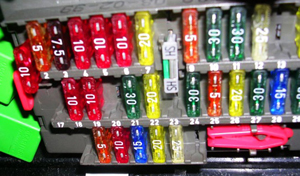 Whatever their design, fuses will be clearly labeled with their ampere ratings. When replacing a fuse, insert one with the exact same rating as the one being removed. Chip style fuses shown here pull out using a special tool designed to grab the end piece.