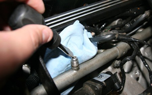Fuel lines on many vehicles will be equipped with a pressure relief valve as seen in this photo. Depressurizing the lines is an important first step when removing an injector.
