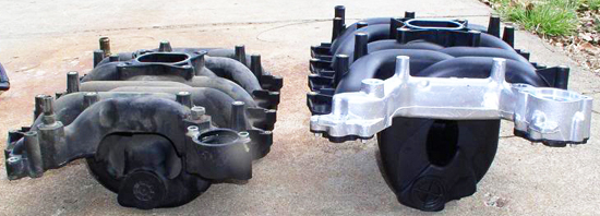 Shown from left to right in this picture are an original factory Ford 4.6-liter plastic intake manifold prone to failure, and an improved aftermarket version with aluminum reinforcements, better seals, and heavier-duty construction with improved plastic composites.
