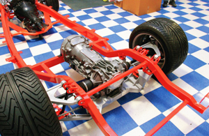 This picture of the rear of a late-model Corvette allows a good look at the layout of a front engine, rear-wheel-drive vehicle with a transaxle integrated into the rear axle.