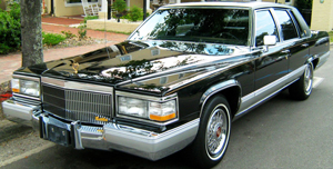 By the end of the 1980s, traditional exposed steel bumpers had been phased out in favor of wraparound plastic bumper covers. Shown here is a 1992 Cadillac Fleetwood Brougham, the last U.S. market production car (besides pickups and SUVs) to wear traditional metal bumpers.