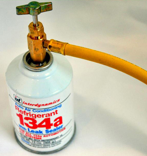 In this photo is a portable can of R-134a refrigerant that’s been mandated by the U.S. government since the 1994 model year. When using a portable can or tank to recharge your system, make sure both the container and the valve knob are facing up as shown here. This ensures you’ll be drawing refrigerant vapor from the top of the can instead of liquid refrigerant that may be at the bottom.