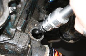 A look at the bottom of a typical distributor, being removed from its mounting point on the engine block.