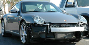 Behind plastic bumper covers on most modern vehicles is a smaller, lighter bumper bar made of steel or aluminum, as seen on this Porsche 911.