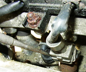 To uncouple electrical wiring on top of an injector, carefully remove any spring clips with a flat head screwdriver, pliers, or other narrow-pointed tool.
