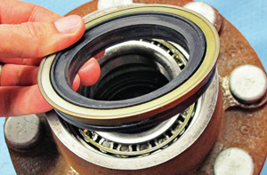 Shown in this picture is a replaceable grease seal that is not part of a wheel hub bearing assembly.