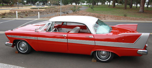 Side view of a white-over-red 1958 Plymouth Fury hardtop sedan, similar to the one in the book.