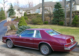 Here, the 1982 Chrysler Imperial featured in this article is seen in front of the house used as Tony Soprano's in the HBO series The Sopranos.  For early-'80s mob guys who were polarized around Lincoln or Cadillac styling, 1981-83 Imperials sought to give them a third choice which had elements of both.