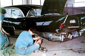 Here, rear quarter panel trim is applied to a 1957 El Morocco in Allender's 2-story workshop in Detroit.