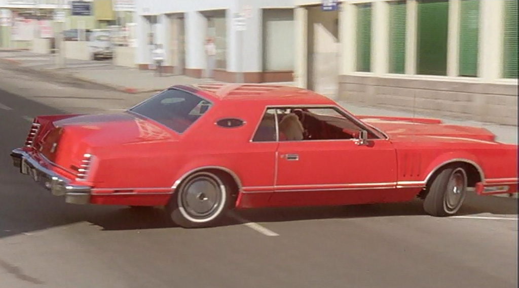 red 1977 Lincoln Mark V, plain roof