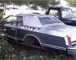 1979 Lincoln Mark V Bill Blass edition rusted in junk yard