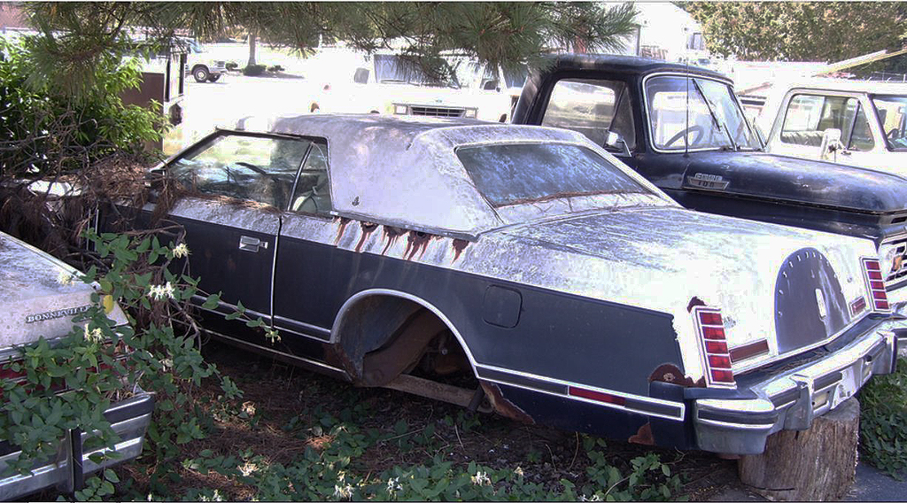 1979 Lincoln Mark V Bill Blass edition rusted in junk yard