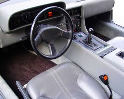 A view of a stock 1981-83 DeLorean DMC-12 interior equipped with 5-speed manual. Credit: DeLorean Motor Company
