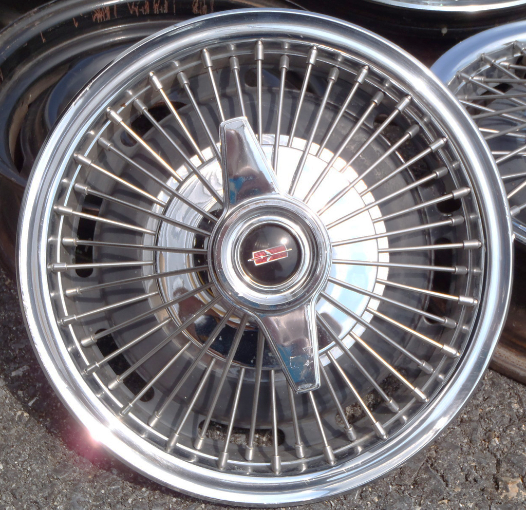 1964-65 Oldsmobile Cutlass 14-inch wire wheel cover