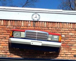 Mercedes 190E front on building