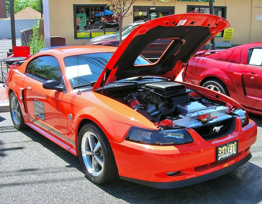 A 2004 Ford Mustang “competition orange” limited-edition Mach 1 coupe, one of 7,182 built.