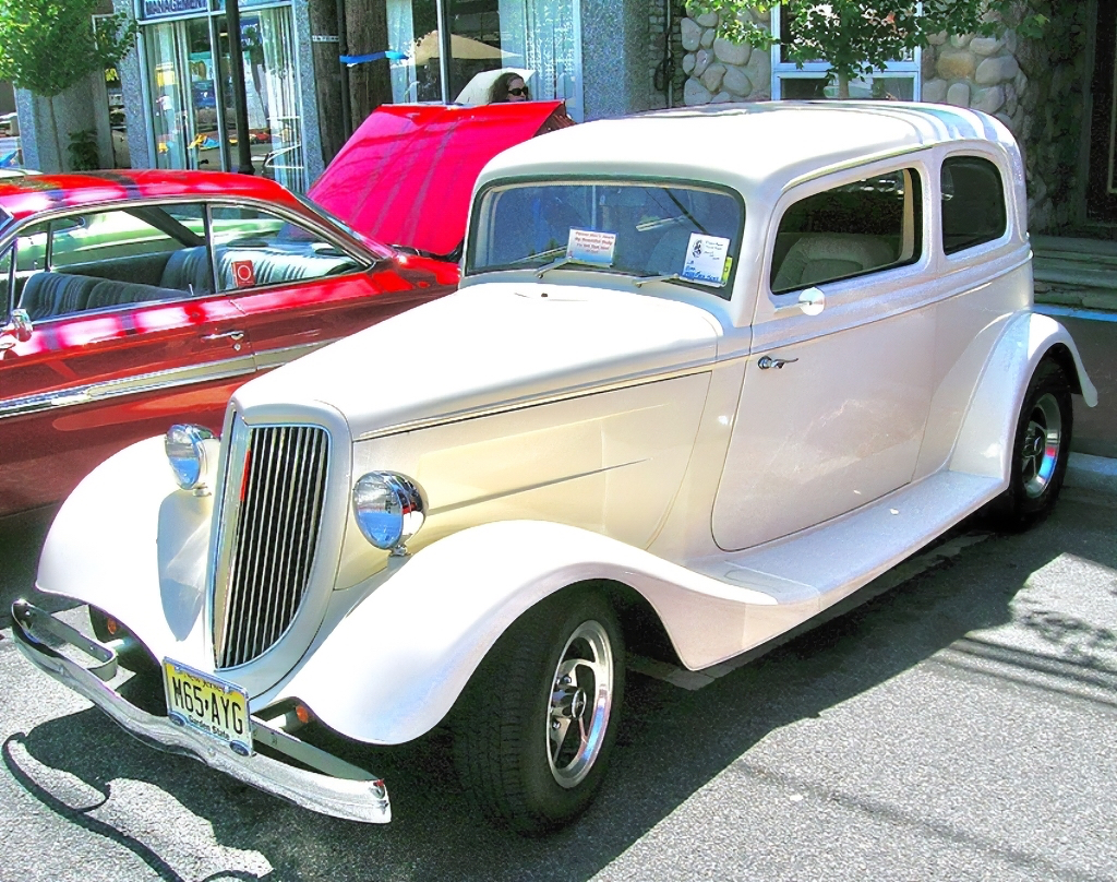 A 1933 Ford “5-window” coupe with lowered roof and souped up factory V8 engine.